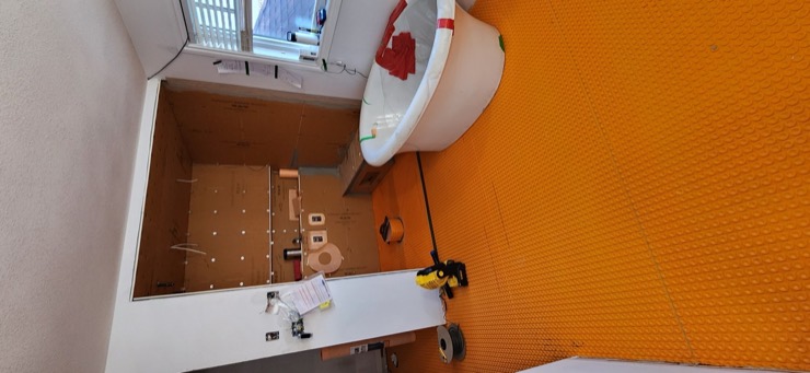 Schluter membrane work during the Luminous Smoke ensuite build